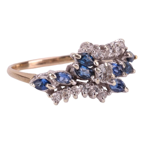 12 - A sapphire and diamond crossover cluster ring, comprising of a central claw-set brilliant-cut diamon... 