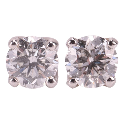 123 - A pair of diamond stud earrings in 18ct white gold, with an estimated total diamond weight of 0.54ct... 