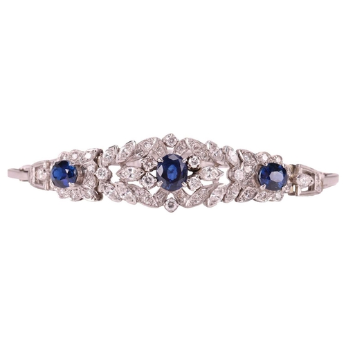 124 - A sapphire and diamond bracelet, centred with a foliate five-section panel embellished with three ci... 