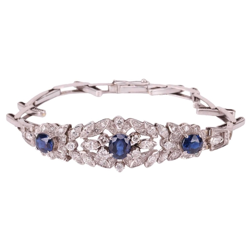 124 - A sapphire and diamond bracelet, centred with a foliate five-section panel embellished with three ci... 