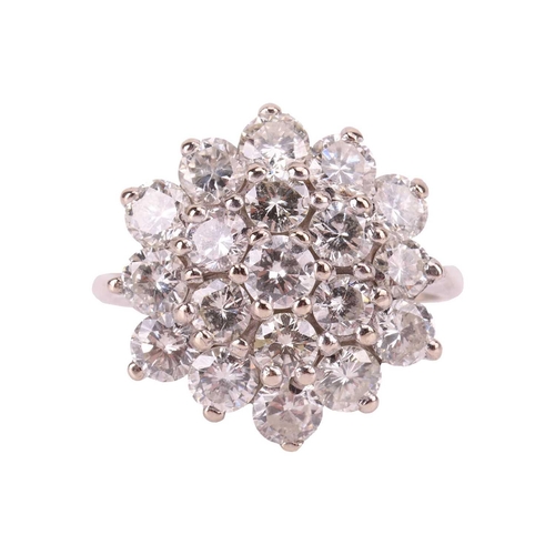 127 - A diamond-set floral cluster ring, featuring nineteen round brilliant cut diamonds, with an estimate... 