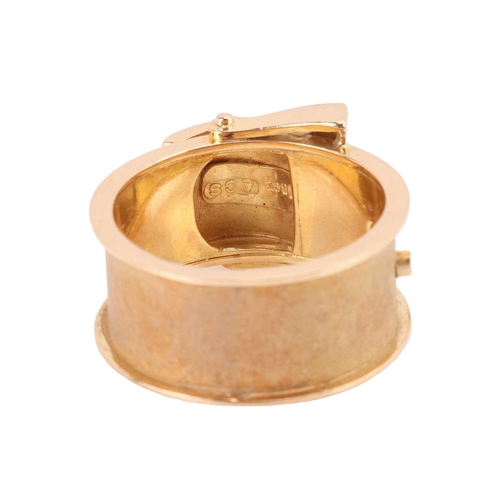 128 - A dress ring in the form of a belt buckle, flat band with sandblast finish and polished trims, yello... 