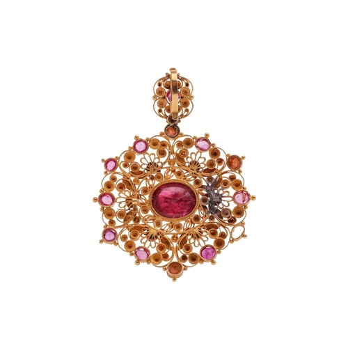 135 - An early to mid-19th century filigree work gem-set pendant; shaped circular set with cabochon ruby a... 