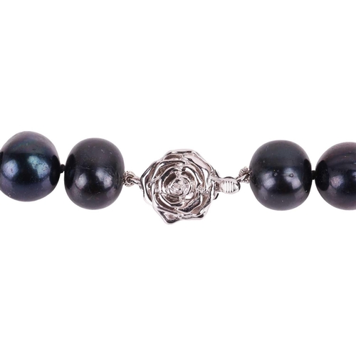 17 - A cultured black pearl necklace, comprising a row of off-round black pearls, measuring 12.3 mm, comp... 