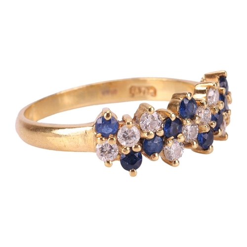 2 - An 18ct sapphire and diamond line ring, with alternating diagonal lines of round cut diamonds and sa... 