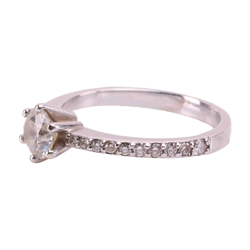 20 - A diamond engagement ring, with approximately 0.70ct of diamonds in total, centred with a round bril... 