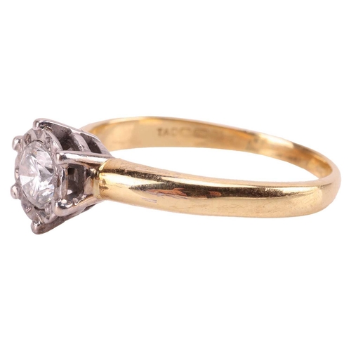 22 - A diamond solitaire ring in 18ct gold, illusion set with a round brilliant cut diamond, estimated di... 