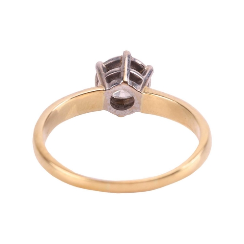 22 - A diamond solitaire ring in 18ct gold, illusion set with a round brilliant cut diamond, estimated di... 