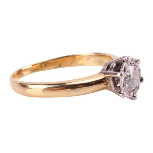 22 - A diamond solitaire ring in 18ct gold, illusion set with a round brilliant cut diamond, estimated di... 