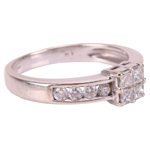 35 - A diamond cluster ring in 18ct white gold, with an estimated total diamond weight of 0.52ct, centred... 