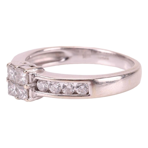 35 - A diamond cluster ring in 18ct white gold, with an estimated total diamond weight of 0.52ct, centred... 