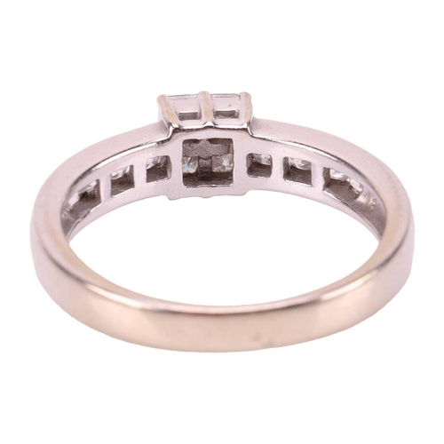 35 - A diamond cluster ring in 18ct white gold, with an estimated total diamond weight of 0.52ct, centred... 