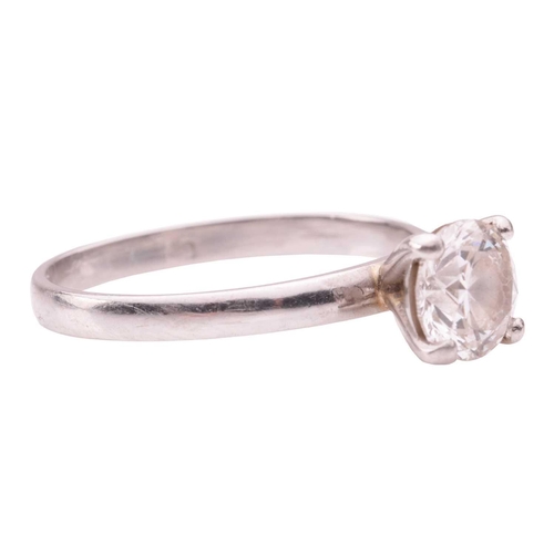 41 - A solitaire diamond ring in platinum, claw-set with a round brilliant cut diamond of 0.90ct and a co... 