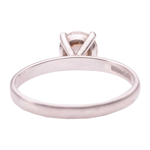 41 - A solitaire diamond ring in platinum, claw-set with a round brilliant cut diamond of 0.90ct and a co... 