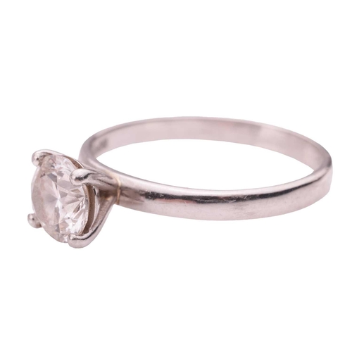 41 - A solitaire diamond ring in platinum, claw-set with a round brilliant cut diamond of 0.90ct and a co... 