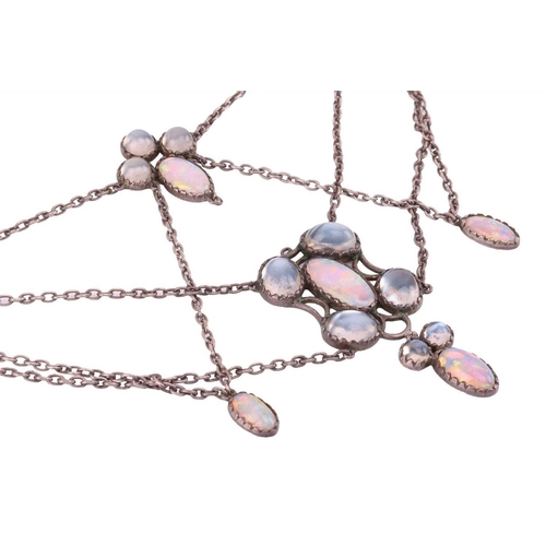 7 - An Art Nouveau moonstone and opal swag necklace, with circular and oval cabochon stones in conformin... 