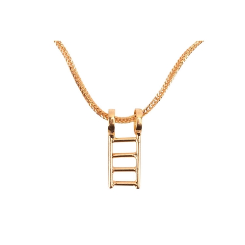 70 - A ladder charm pendant on chain, to a foxtail chain with S-hook clasp, in yellow metal stamped '916'... 