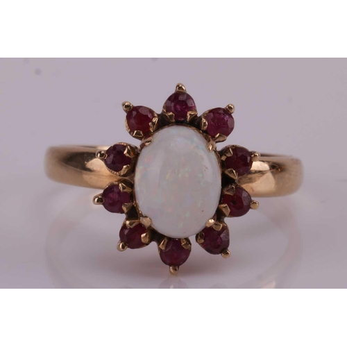 77A - Two gem-set dress rings; comprising an opal and ruby floral cluster ring, the central opal cabochon ... 