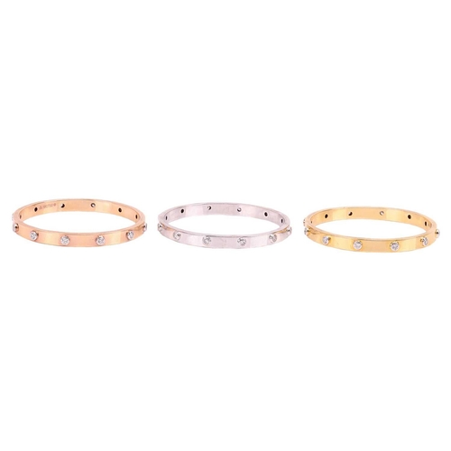 79 - A set of three diamond-set bangles, each closed bangle set with twelve round-cut diamonds, each bang... 