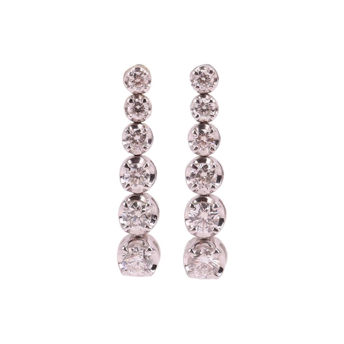 8 - Two pairs of earrings; including a pair of diamond drop earrings comprising a graduated line of six ... 