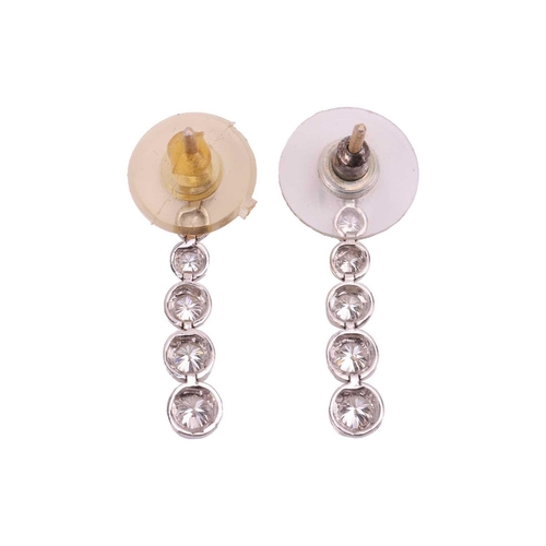 8 - Two pairs of earrings; including a pair of diamond drop earrings comprising a graduated line of six ... 