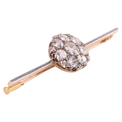 87 - A diamond cluster bar brooch, with an estimated total diamond weight of 2.82ct, the round cluster co... 