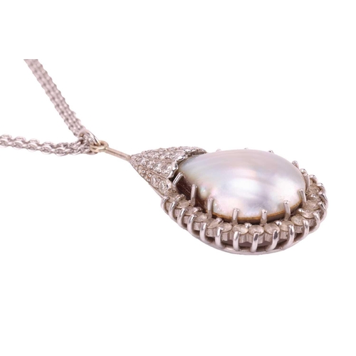 9 - A mabé pearl pendant, the pear-shaped pendant centrally-set with a mabé pearl and surrounded by roun... 