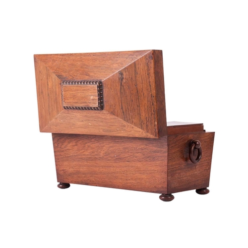 109 - A William IV figured rosewood sarcophagus two-section tea caddy, with a central blending bowl, suppo... 