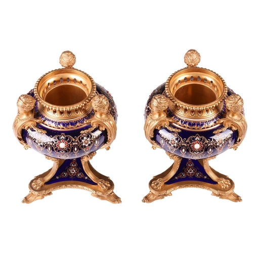 122 - A pair of Sevres style, ormolu mounted French Blu De Roi porcelain potpourri urns, the second half o... 