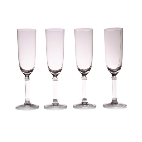 131 - Tiffany & Co: a set of eight glass champagne flutes, etched mark to the bases, apparently unused, an... 