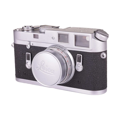 143 - A Leica M4 Rangefinder Camera,1970, chrome, serial no. 1207564, fitted with a Leitz Elmar 1:2.8/50mm... 