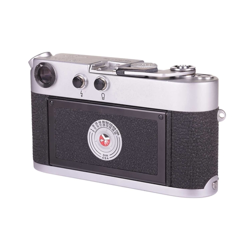 143 - A Leica M4 Rangefinder Camera,1970, chrome, serial no. 1207564, fitted with a Leitz Elmar 1:2.8/50mm... 