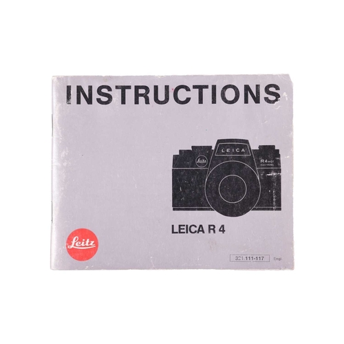 145 - A Leica R4 camera, black, 1983, serial number 1623372, with original instruction booklet, fitted wit... 