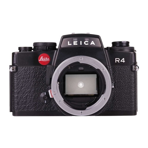 145 - A Leica R4 camera, black, 1983, serial number 1623372, with original instruction booklet, fitted wit... 