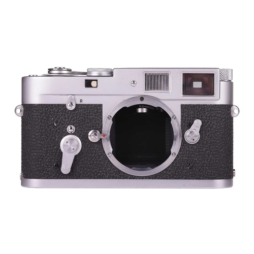 148 - A Leica M2 Rangefinder Camera Body, 1964, chrome, serial number 1092949, with brown leather Leica ca... 