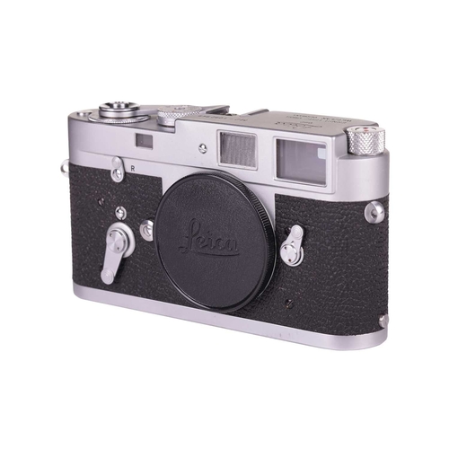 148 - A Leica M2 Rangefinder Camera Body, 1964, chrome, serial number 1092949, with brown leather Leica ca... 