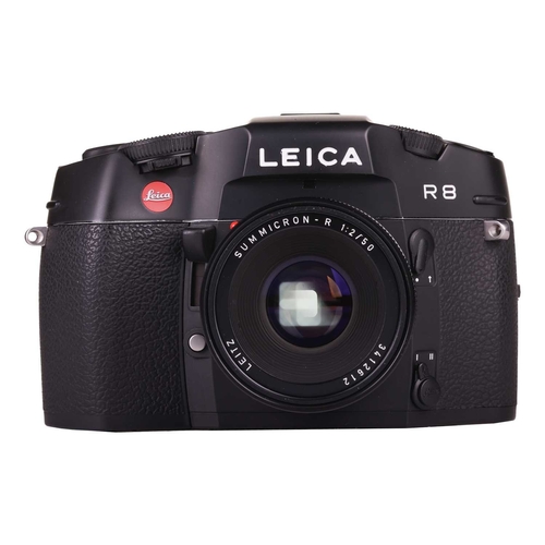 152 - A Leica R8 SLR Camera, 2000, black, serial no. 2476807, in original box with warranty paperwork (now... 