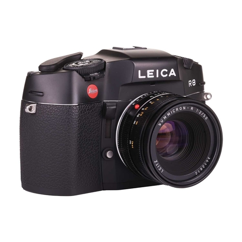 152 - A Leica R8 SLR Camera, 2000, black, serial no. 2476807, in original box with warranty paperwork (now... 