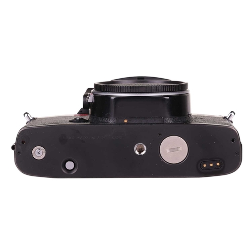 153 - A Leica R5 camera body, black, 1988, serial number 1733870, unboxed, fitted with a Leica Motor-Winde... 