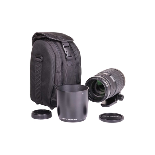 154 - An Olympus Zuiko Digital ED Lens, 50-200mm f2.8-3.5, with front and rear covers, fitted with an Olym... 