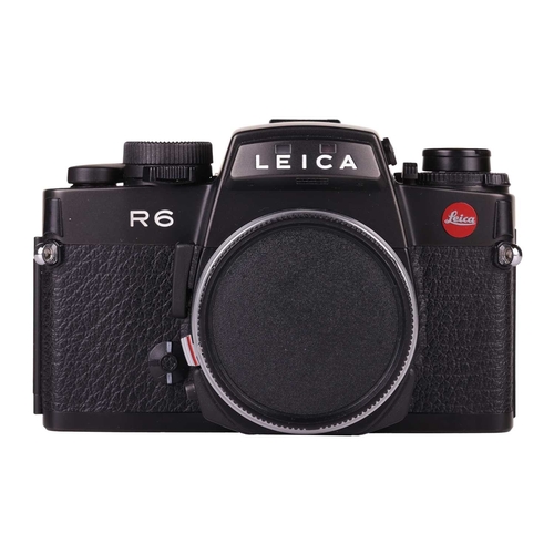 155 - A Leica R6 SLR Camera body, 1987, Made in Germany, black, serial no. 1729282, in original case and b... 