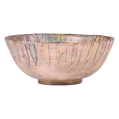 41 - A Nishapur polychromic circular pottery bowl, 10th century, the interior with segmented panels of pe... 