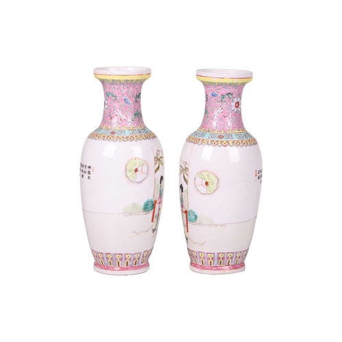 42 - A pair of Chinese late republic Famille Rose porcelain baluster vases, painted with figures in forma... 