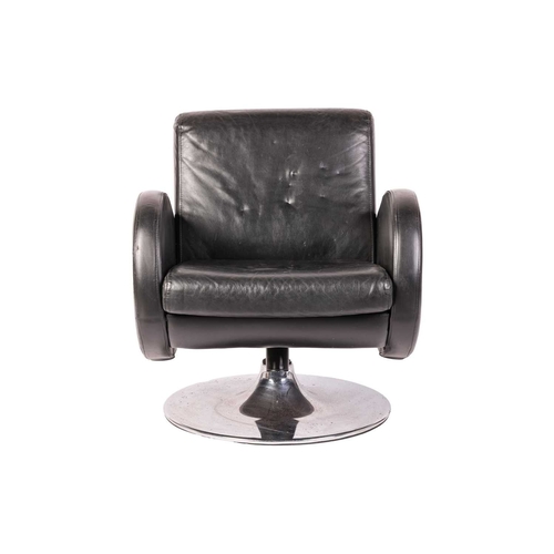 50 - A 'Mid Century Vintage' black leather swivel armchair, with rollover arms and spreading chrome disc ... 