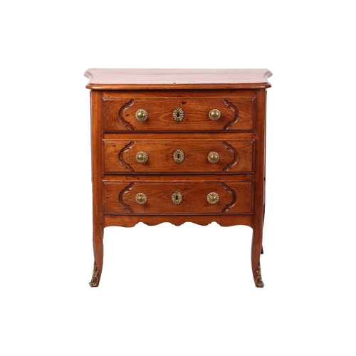 58 - A French 19th-century provincial fruitwood commode of small proportions, with gently bowed front and... 