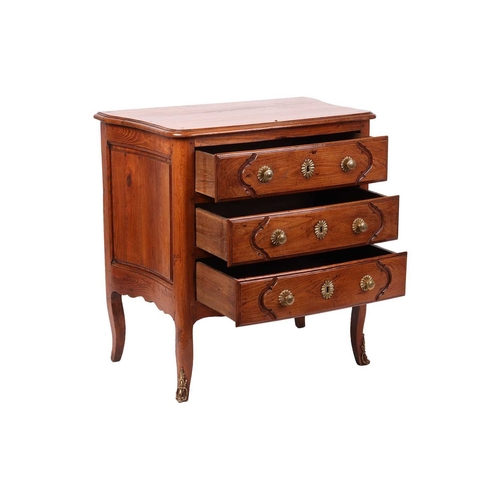 58 - A French 19th-century provincial fruitwood commode of small proportions, with gently bowed front and... 