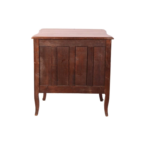 58 - A French 19th-century provincial fruitwood commode of small proportions, with gently bowed front and... 