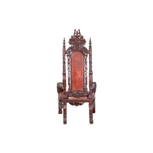 60 - A large, almost theatrical, heavily carved masters-type open throne chair with turned and carved bac... 