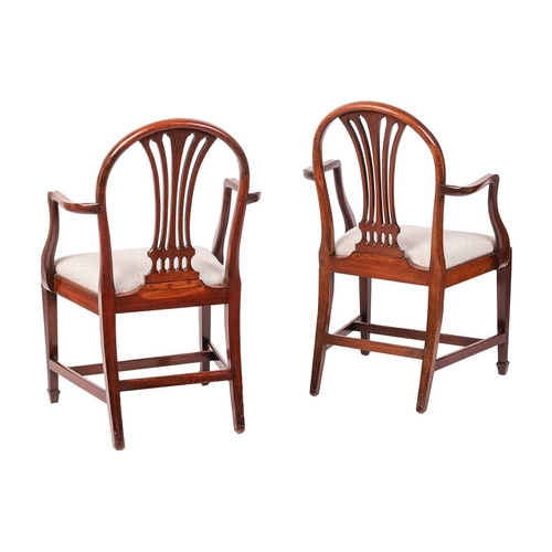 61 - A set of six early 19th-century Hepplewhite design mahogany dining chairs with arched backs and bull... 