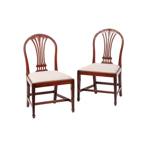 61 - A set of six early 19th-century Hepplewhite design mahogany dining chairs with arched backs and bull... 